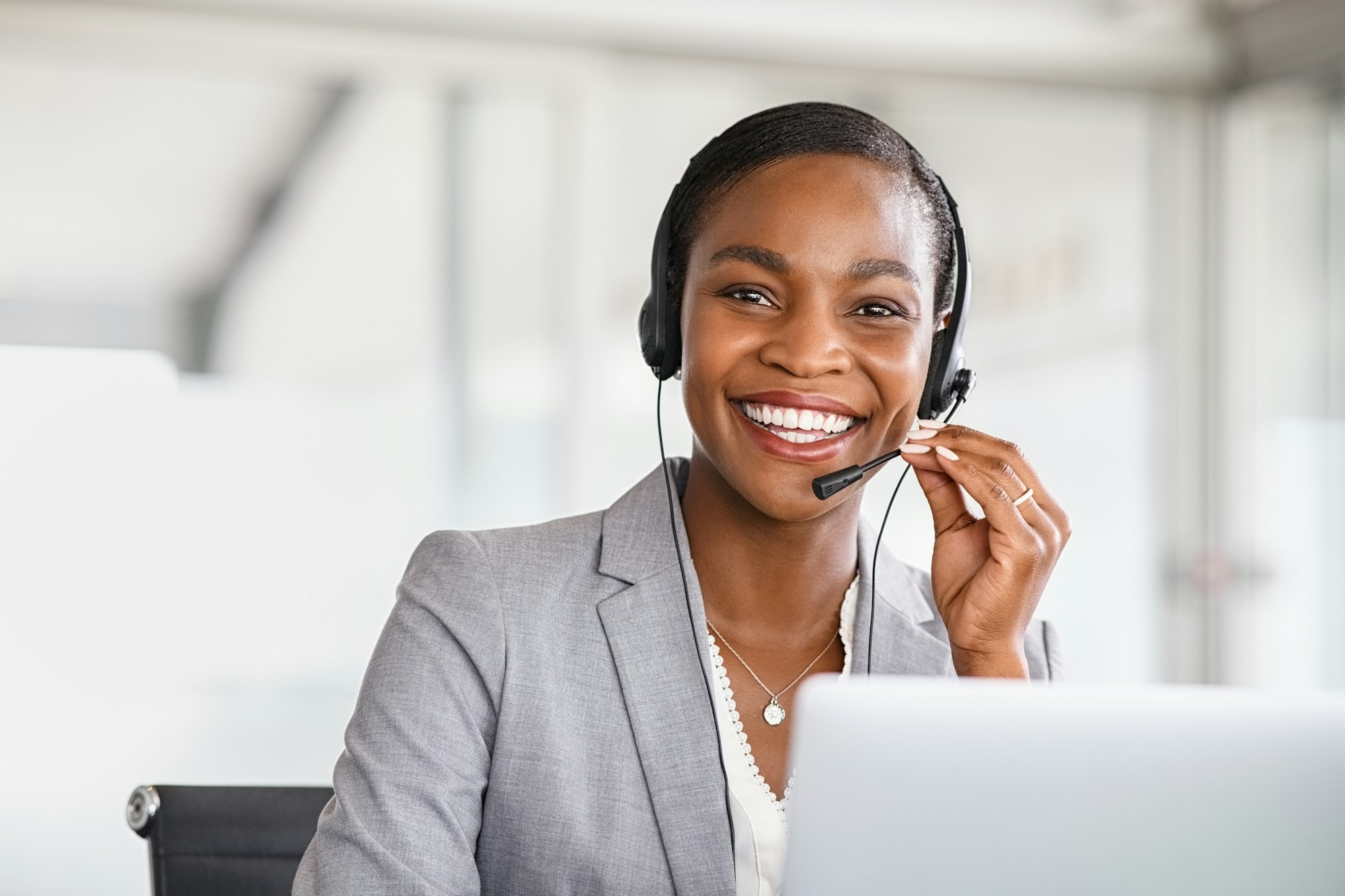 Portrait of customer service woman working on call center